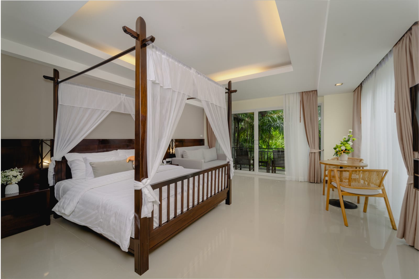 A guest room at Railay Princess Resort & Spa looking out over the garden and cliffs