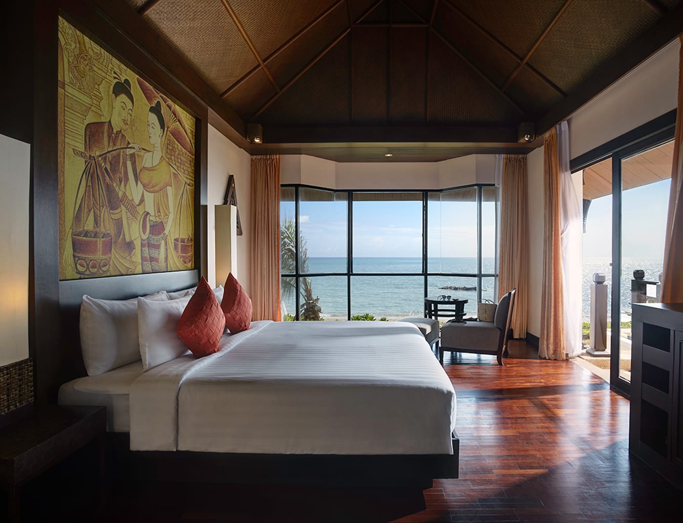 A hillside room at Rawi Warin with a balcony overlooking the forest and sea