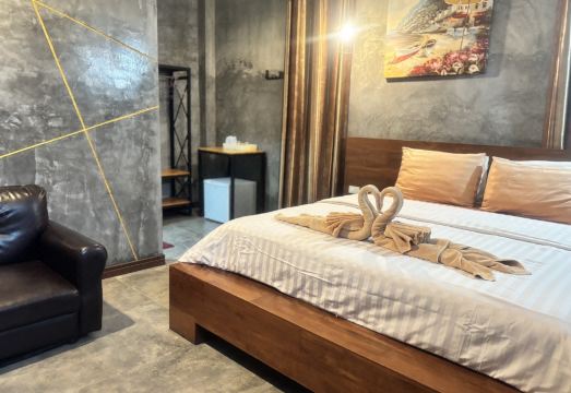 ห้องพักสไตล์ปูนเปลือยของ Le Park 23 เตียงใหญ่ ผนังปูนเปลือยโทนเทาอุ่น
