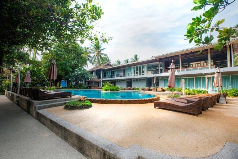 Bungalows and an outdoor swimming pool amid the tropical garden at Sand Sea Resort Railay