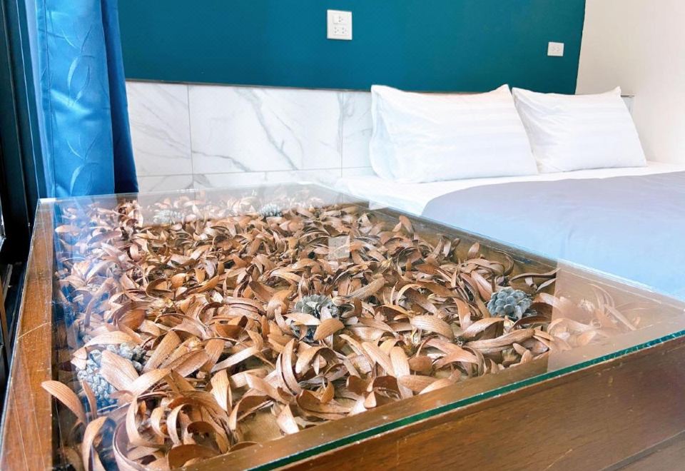 มุมห้องพักและสิ่งอำนวยความสะดวกในห้องของ Petchngam Home Resort อู่ทอง