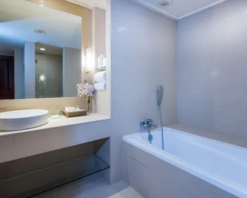 Guest room interior at The Emerald Hotel Bangkok Ratchada — classic, spacious layout