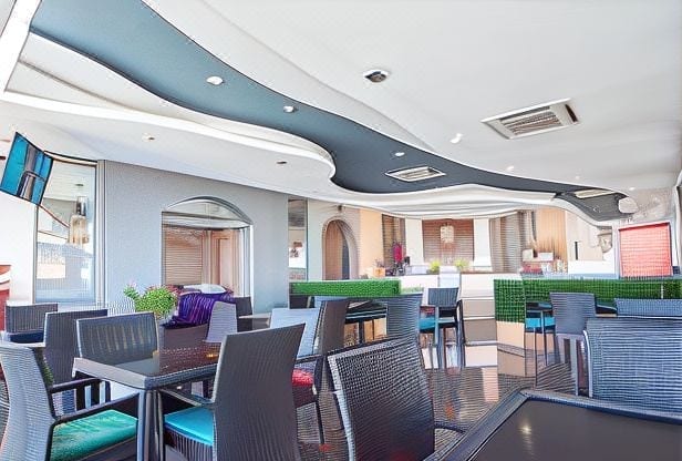 มุมห้องพักและพื้นที่นั่งเล่นของ De Proud Hotel อุบลราชธานี